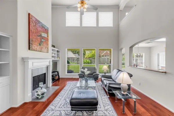 a living room with furniture fireplace and flat screen tv