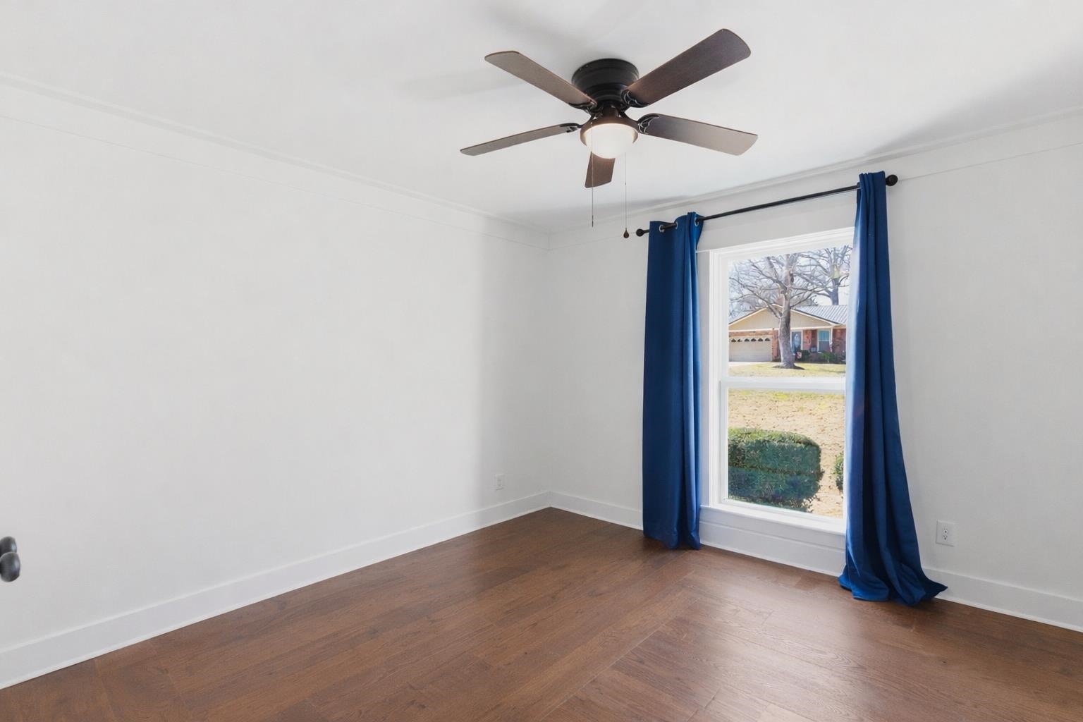 222 Barrett Street Bolivar, TN 38008 - Photo 13 of 30 Spare room with dark wood-style flooring and ceiling fan