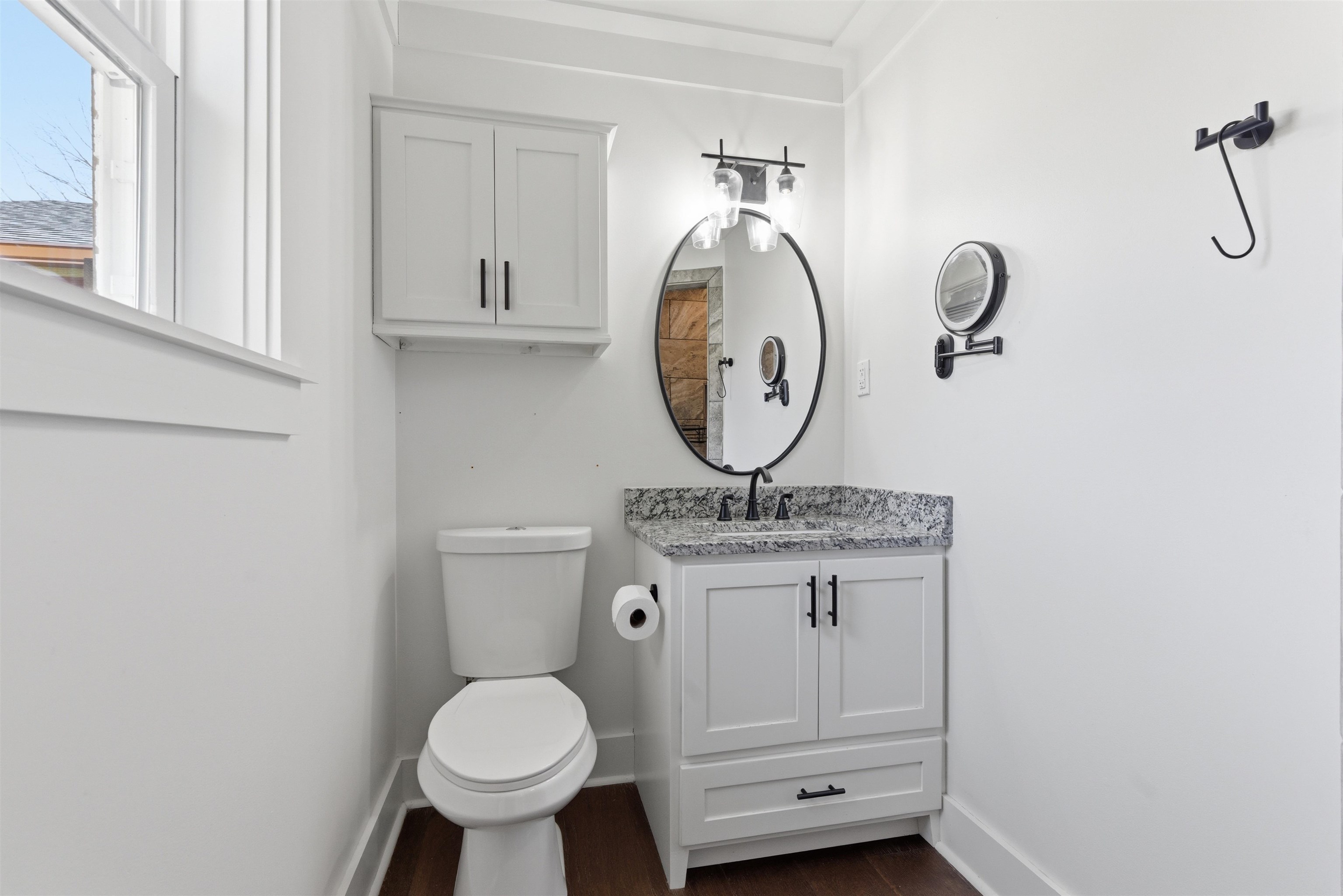 222 Barrett Street Bolivar, TN 38008 - Photo 20 of 30 Bathroom featuring vanity and dark wood-style flooring