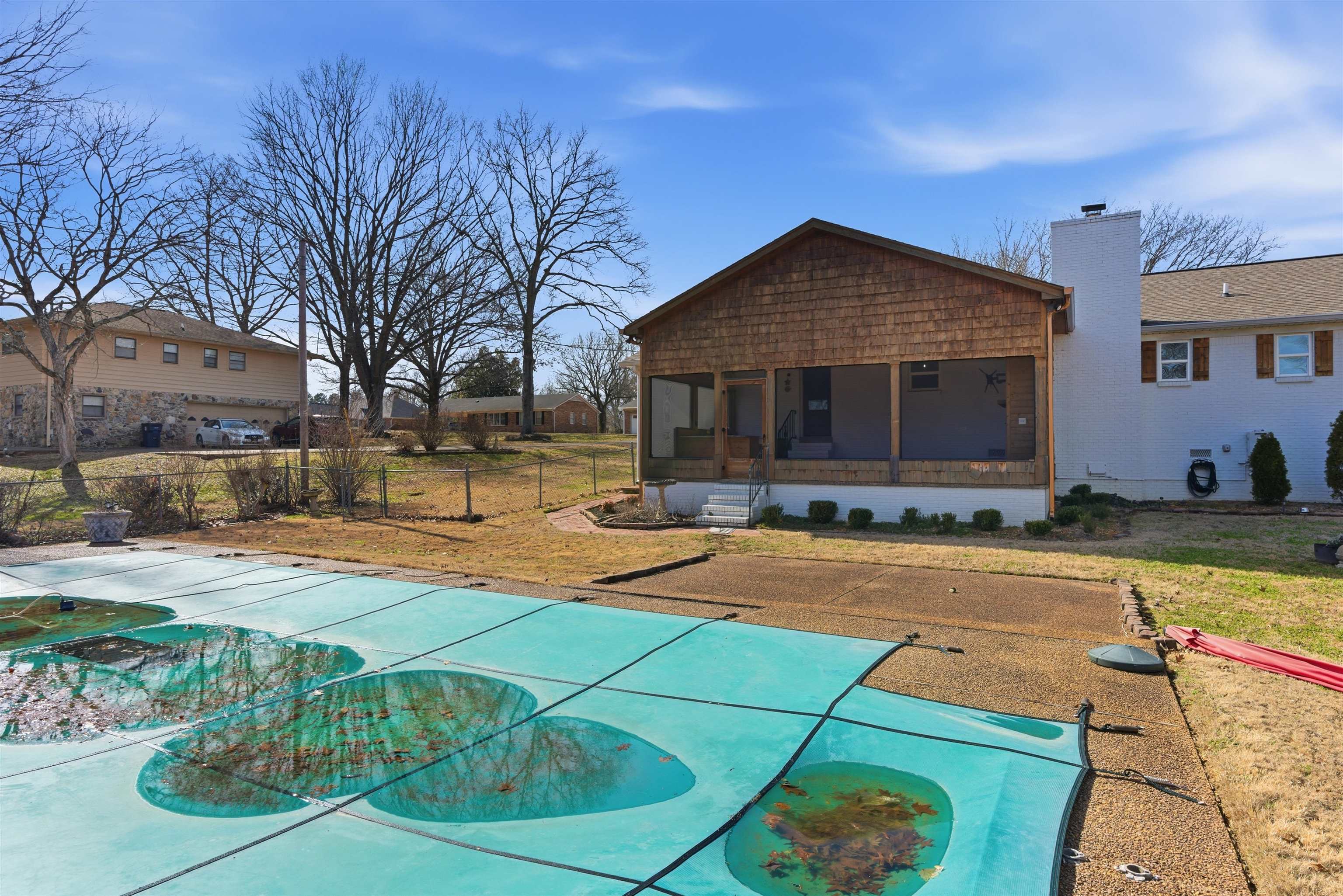 222 Barrett Street Bolivar, TN 38008 - Photo 29 of 30 View of swimming pool featuring a sunroom and a covered pool