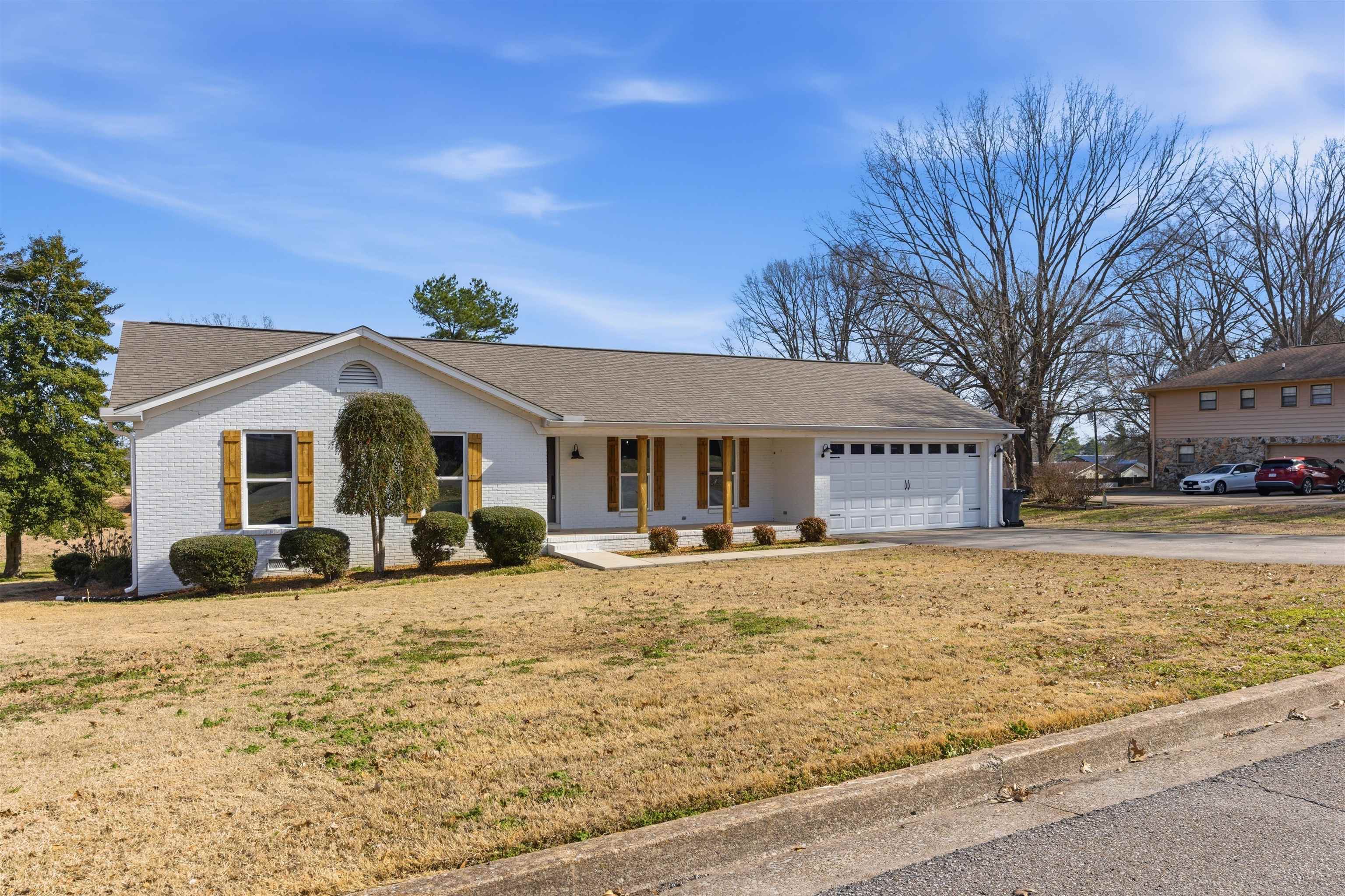 222 Barrett Street Bolivar, TN 38008 - Photo 3 of 30 Single story home featuring a porch, a front lawn, and brick siding