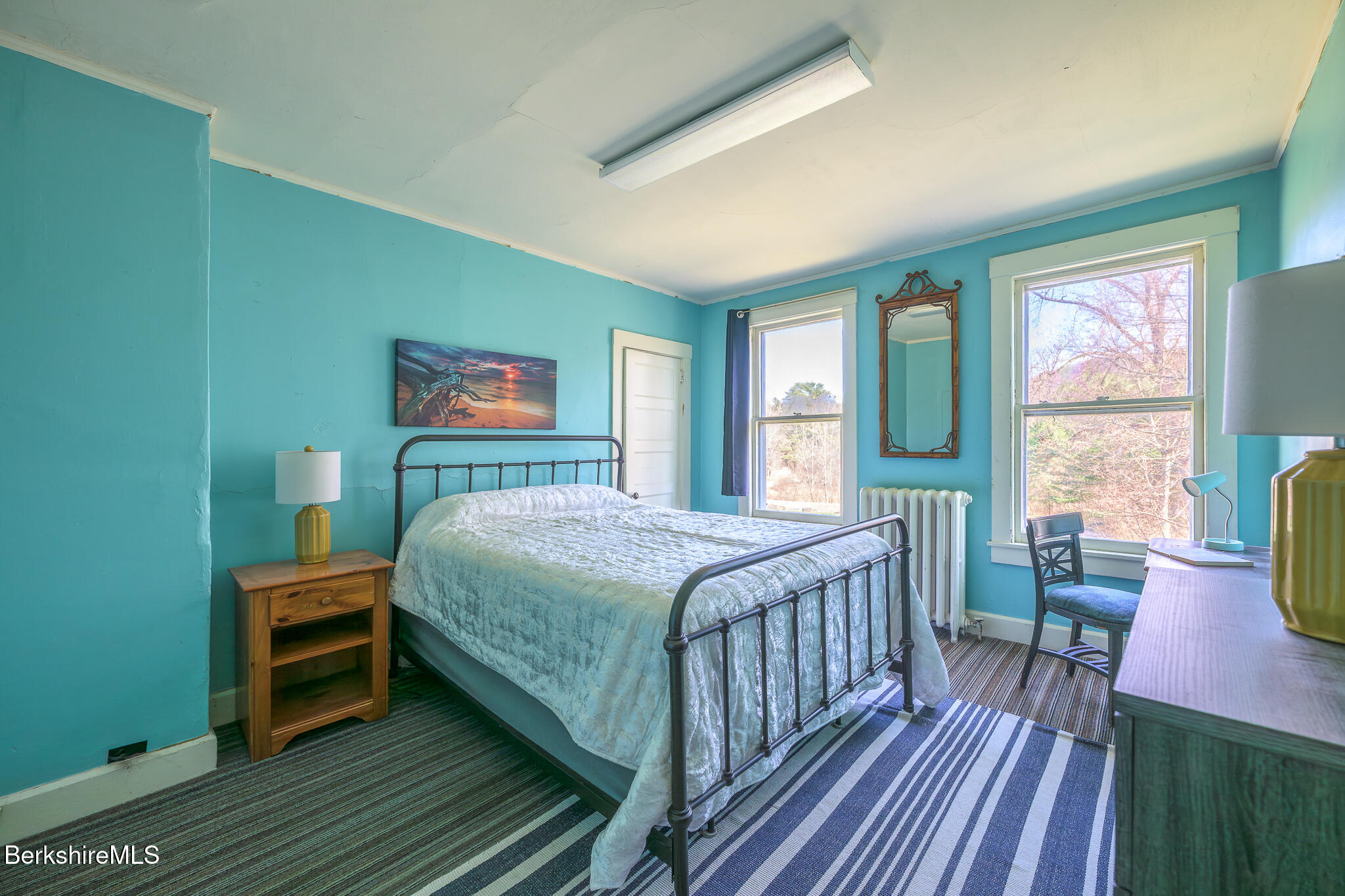 6 East Street Stockbridge, MA 01262 - Photo 17 of 23 a bedroom with a bed wooden floor and a large window