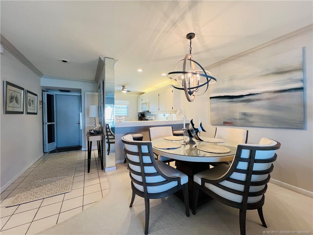 1550 Northeast Ocean Boulevard, Unit C204 Stuart, FL 34996 - Photo 12 of 54 a view of a dining room with furniture