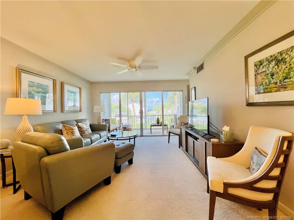 1550 Northeast Ocean Boulevard, Unit C204 Stuart, FL 34996 - Photo 13 of 54 a living room with furniture and a large window