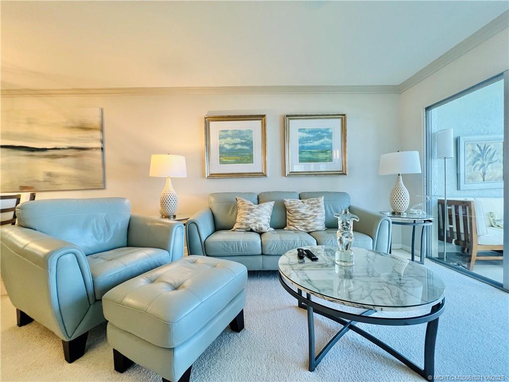1550 Northeast Ocean Boulevard, Unit C204 Stuart, FL 34996 - Photo 14 of 54 a living room with furniture and a window