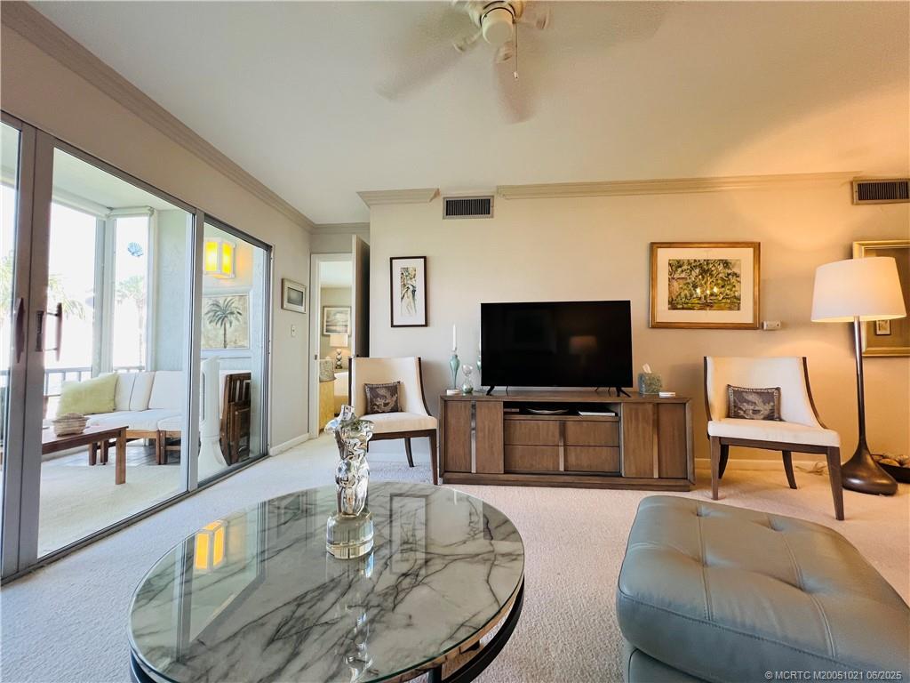 1550 Northeast Ocean Boulevard, Unit C204 Stuart, FL 34996 - Photo 16 of 54 a living room with furniture and a flat screen tv