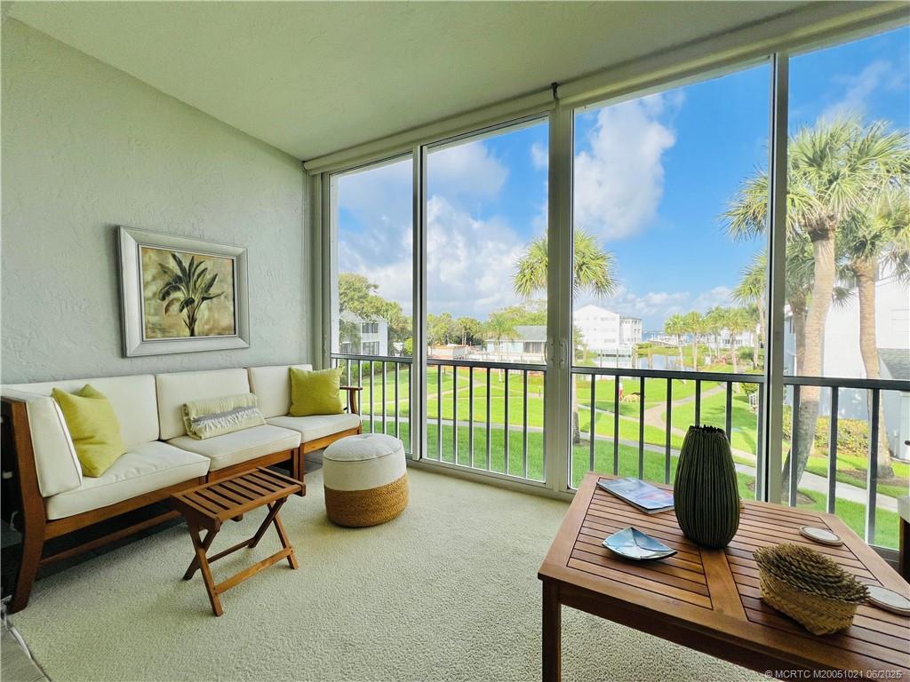 1550 Northeast Ocean Boulevard, Unit C204 Stuart, FL 34996 - Photo 19 of 54 a living room with furniture and a window