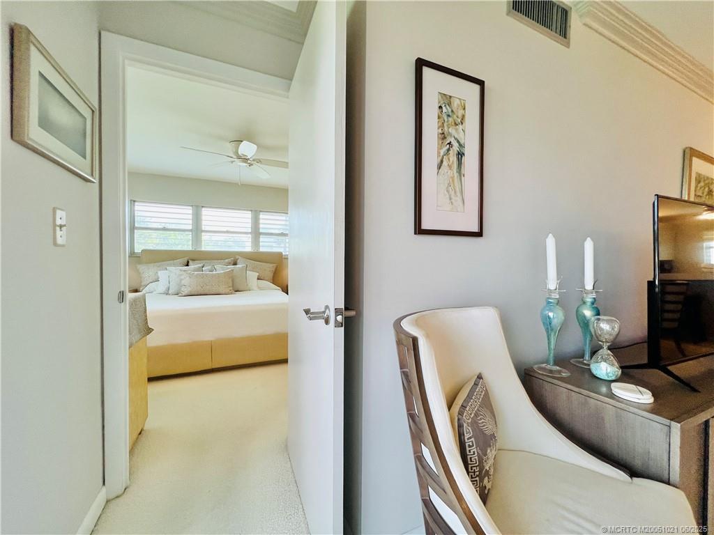 1550 Northeast Ocean Boulevard, Unit C204 Stuart, FL 34996 - Photo 24 of 54 a bedroom with furniture and a large mirror
