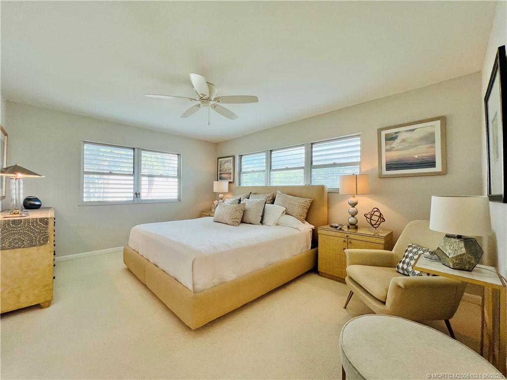 1550 Northeast Ocean Boulevard, Unit C204 Stuart, FL 34996 - Photo 26 of 54 a spacious bedroom with two beds and a couch