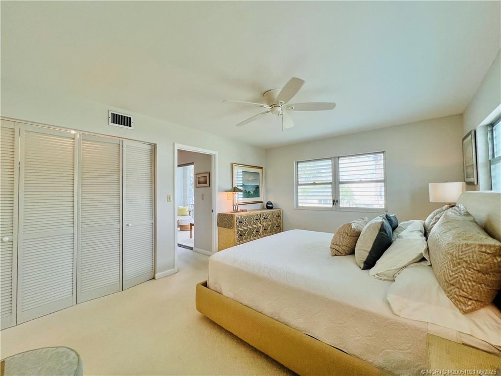 1550 Northeast Ocean Boulevard, Unit C204 Stuart, FL 34996 - Photo 27 of 54 a bedroom with a bed and window