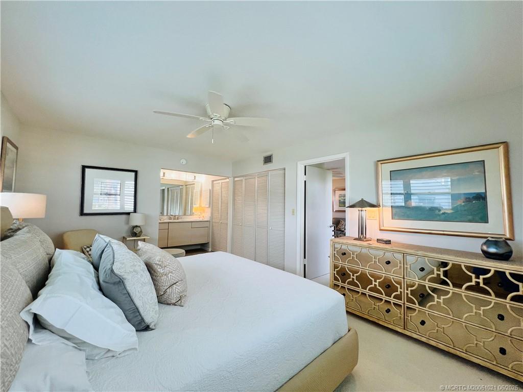 1550 Northeast Ocean Boulevard, Unit C204 Stuart, FL 34996 - Photo 28 of 54 a bed room with a bed and furniture