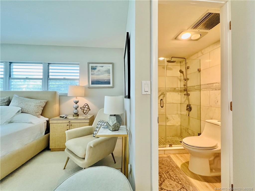 1550 Northeast Ocean Boulevard, Unit C204 Stuart, FL 34996 - Photo 33 of 54 a living room with a couch and a table