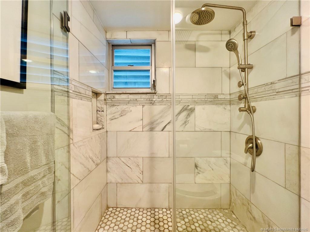 1550 Northeast Ocean Boulevard, Unit C204 Stuart, FL 34996 - Photo 35 of 54 a bathroom with a shower