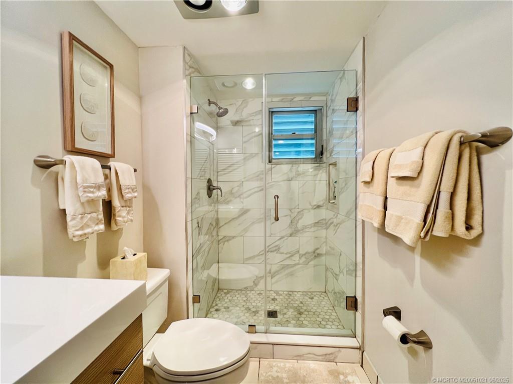 1550 Northeast Ocean Boulevard, Unit C204 Stuart, FL 34996 - Photo 45 of 54 a bathroom with a sink toilet and shower