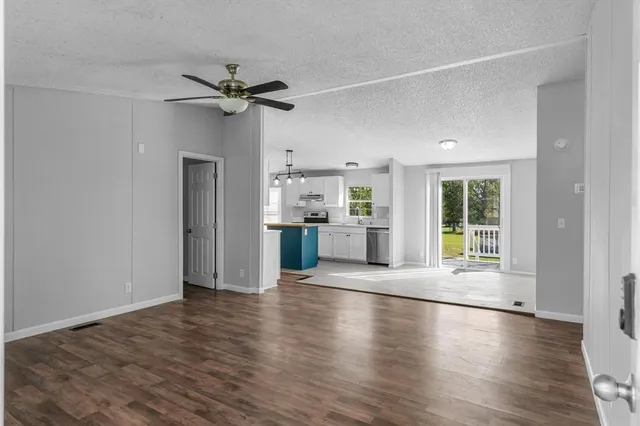 a view of a kitchen with a sink and a window