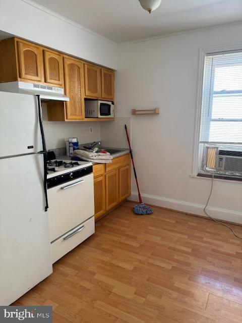 1715 North 17th Street Philadelphia, PA 19121 - Photo 6 of 8 a view of a kitchen with wooden floor and electronic appliances