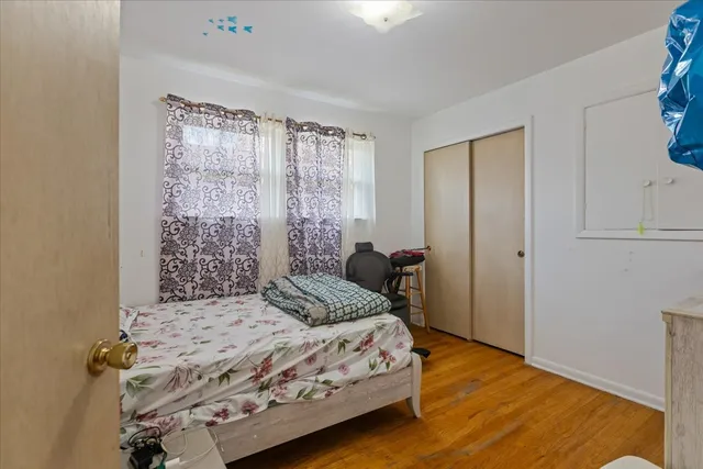 a bedroom with a bed and a dresser