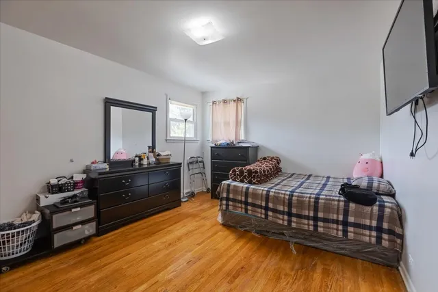 a bathroom with a granite countertop sink mirror vanity and toilet