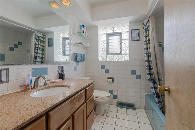 a view of storage and utility room with a window