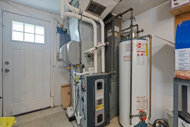 a bedroom with a bed and a dresser in it