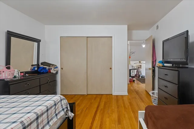 a view of a hallway with a livingroom and a dining room with furniture
