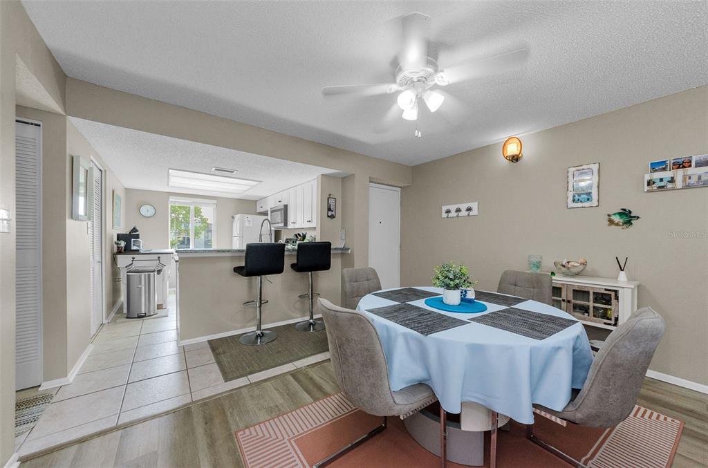 146 Cypress Lane Oldsmar, FL 34677 - Photo 11 of 44 a view of a dining room with furniture and chandelier
