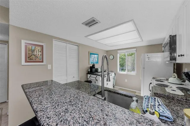 a living room with furniture rug and window