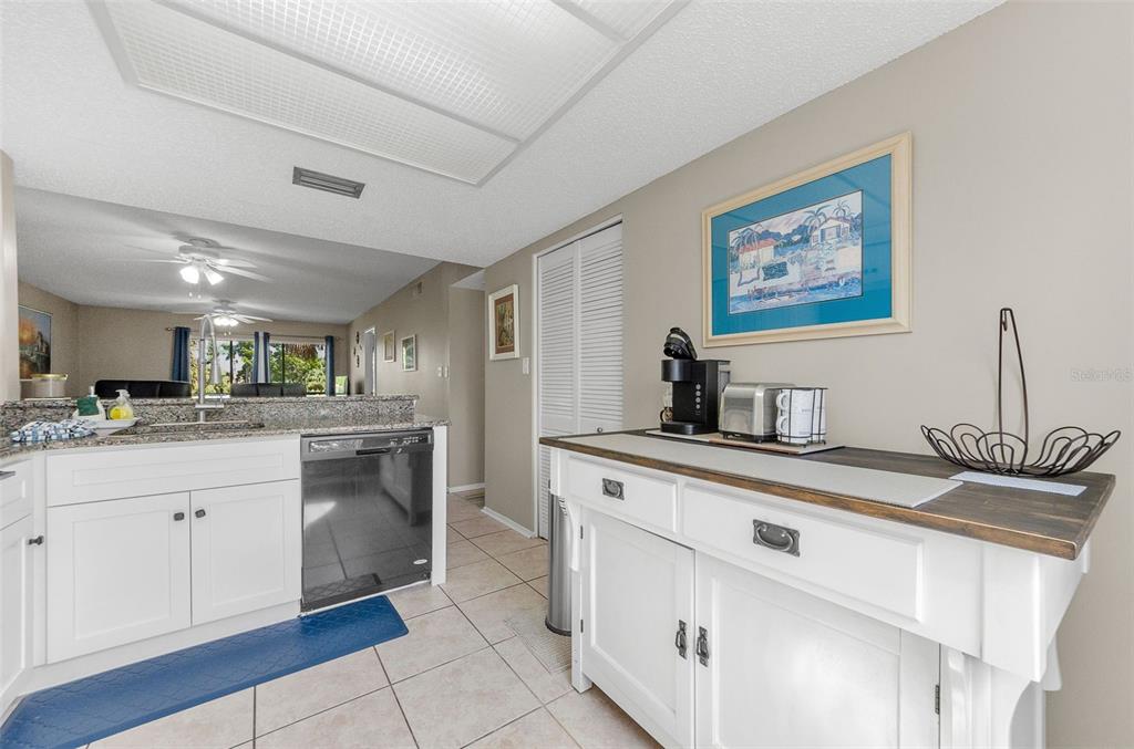 146 Cypress Lane Oldsmar, FL 34677 - Photo 17 of 44 a kitchen with stainless steel appliances granite countertop a sink and cabinets