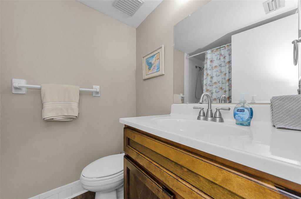 146 Cypress Lane Oldsmar, FL 34677 - Photo 25 of 44 a bathroom with a sink toilet and a mirror