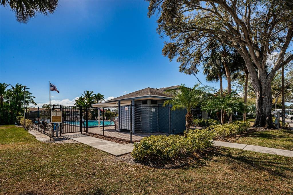 146 Cypress Lane Oldsmar, FL 34677 - Photo 30 of 44 a front view of a house with a yard