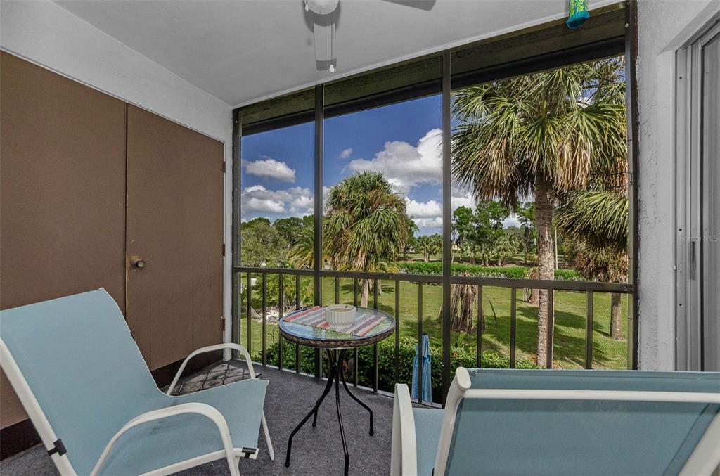 146 Cypress Lane Oldsmar, FL 34677 - Photo 3 of 44 a view of a balcony dining table and chairs