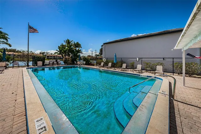 a view of a swimming pool with a patio