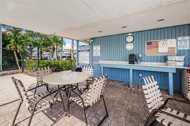 a view of a dining room with furniture and window