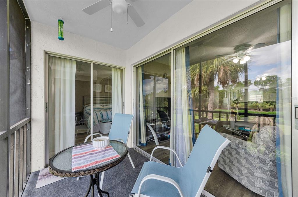 146 Cypress Lane Oldsmar, FL 34677 - Photo 6 of 44 a living room with furniture and a floor to ceiling window
