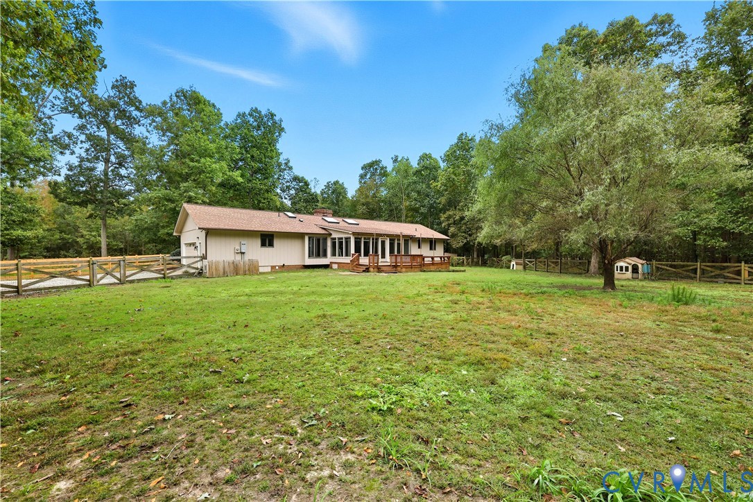 8100 Gold Acres Farm Road Prince George, VA 23875 - Photo 11 of 50 Fenced backyard with view of scattered trees