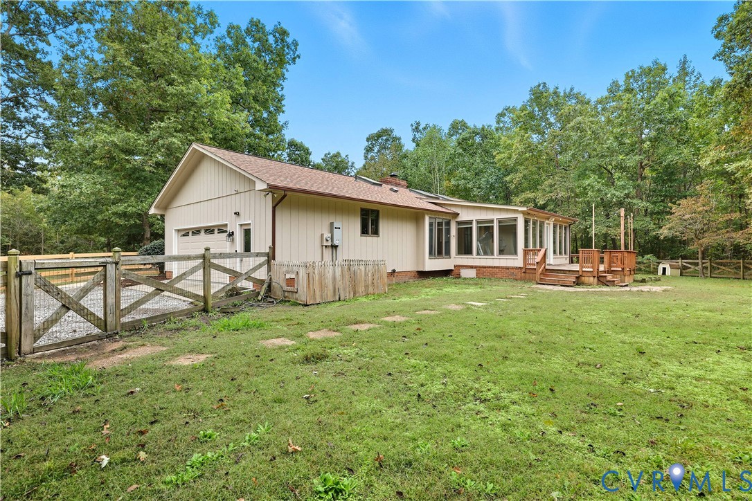 8100 Gold Acres Farm Road Prince George, VA 23875 - Photo 13 of 50 Back of property featuring a gate, a sunroom, a wo