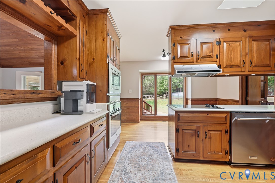 8100 Gold Acres Farm Road Prince George, VA 23875 - Photo 19 of 50 Kitchen with brown cabinets, appliances with stain