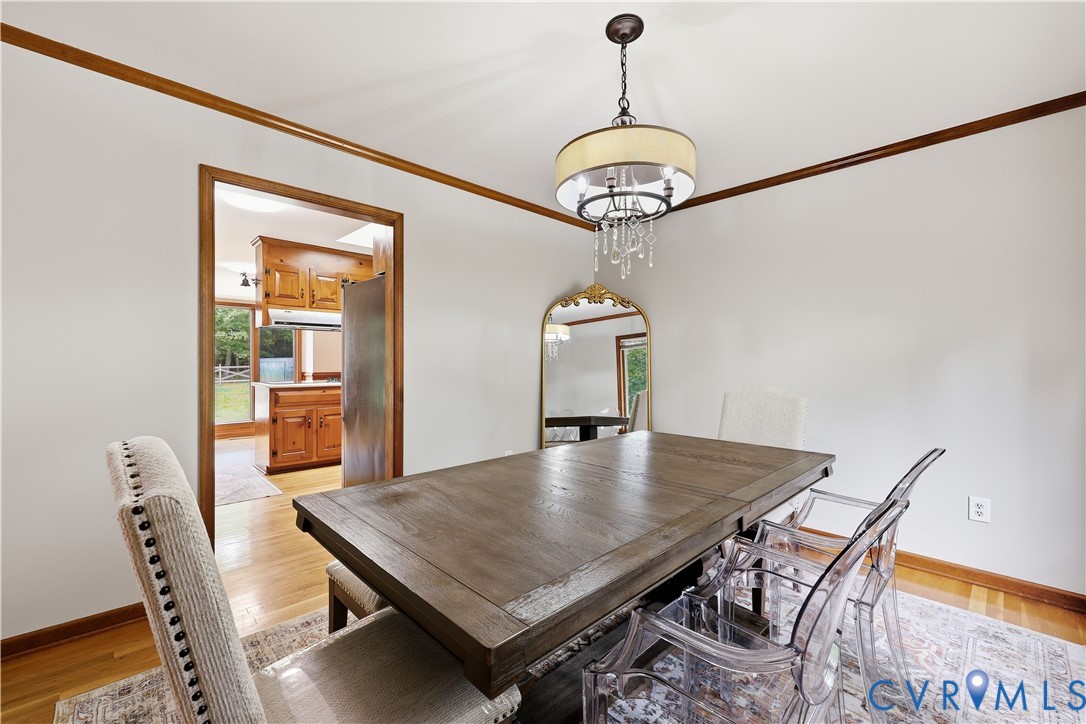 8100 Gold Acres Farm Road Prince George, VA 23875 - Photo 23 of 50 Dining room with crown molding, light wood-style f