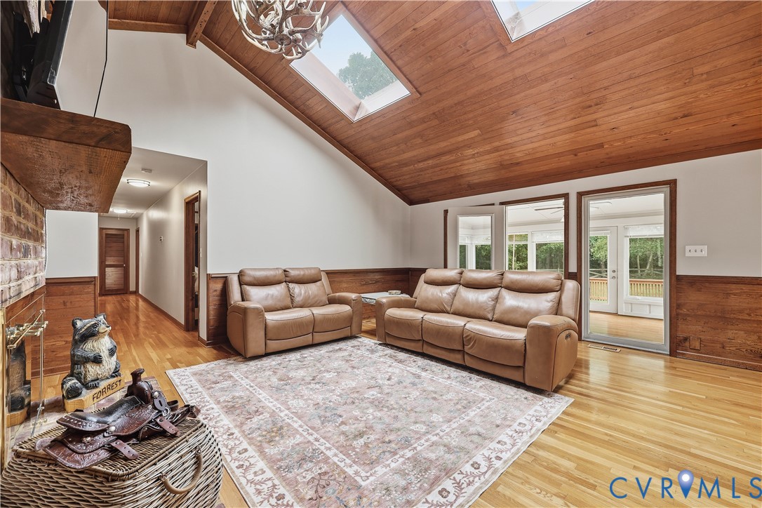 8100 Gold Acres Farm Road Prince George, VA 23875 - Photo 25 of 50 Living area featuring wainscoting, wooden walls, l