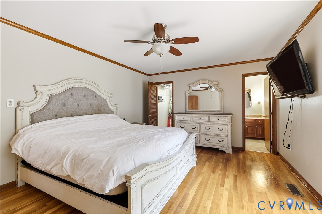 8100 Gold Acres Farm Road Prince George, VA 23875 - Photo 37 of 50 Bedroom featuring light wood finished floors, orna