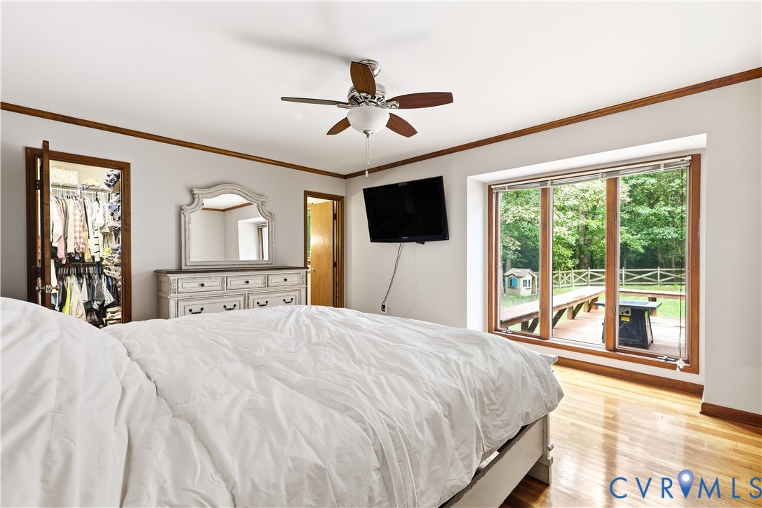 8100 Gold Acres Farm Road Prince George, VA 23875 - Photo 38 of 50 Bedroom with crown molding, light wood-style floor