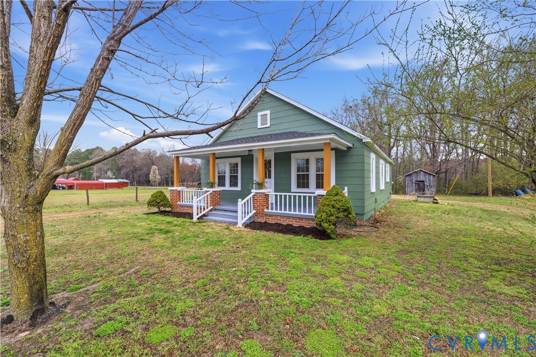 239 Brunswick Road Emporia, VA 23847 - Photo 1 of 24 Exterior featuring a covered porch with natural wo