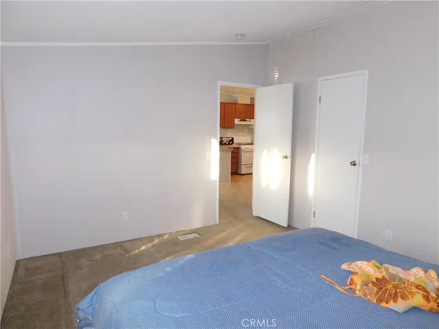 a view of a room with wooden floor and closet