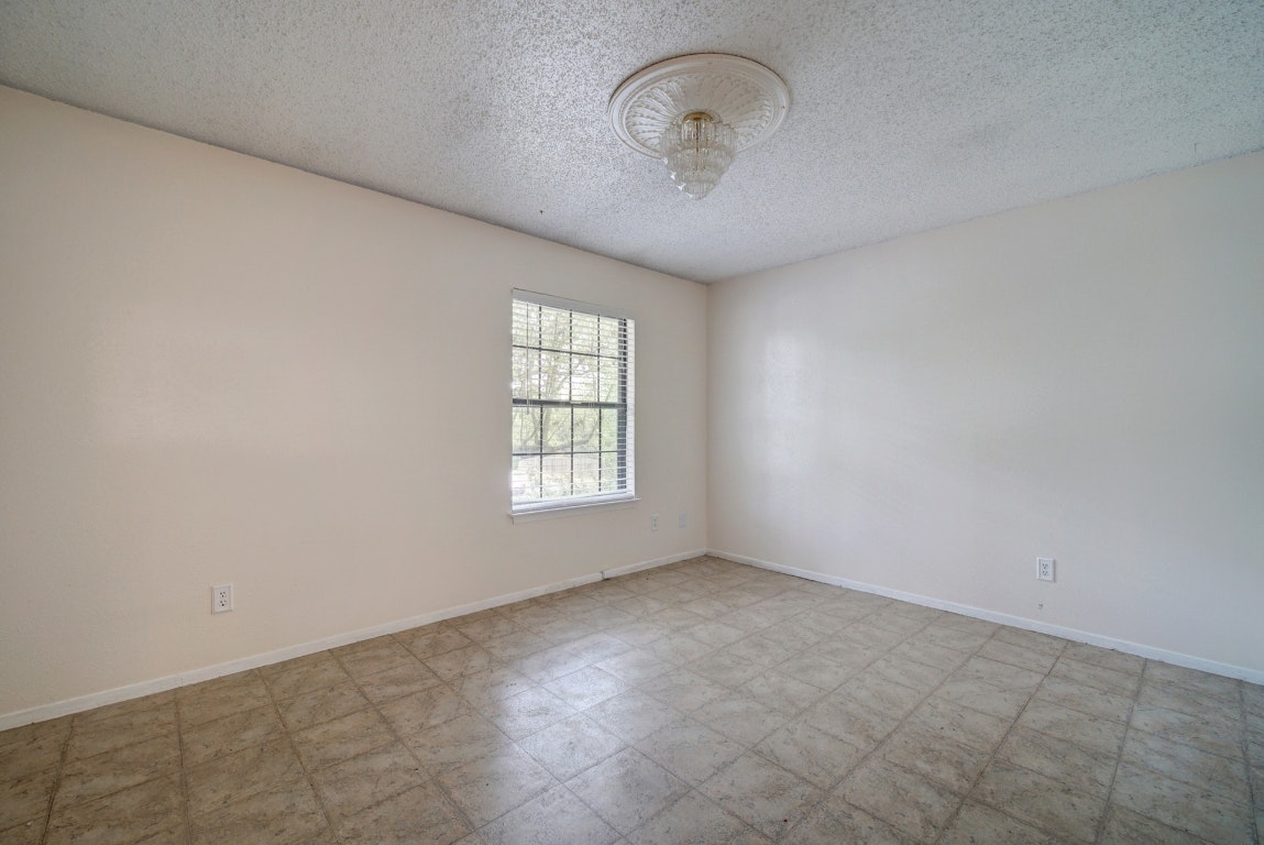 10509 Doering Lane Austin, TX 78750 - Photo 18 of 36 an empty room with a empty space and windows