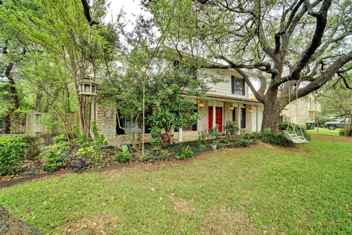 10509 Doering Lane Austin, TX 78750 - Photo 2 of 36 a view of house in front of a big yard with large trees