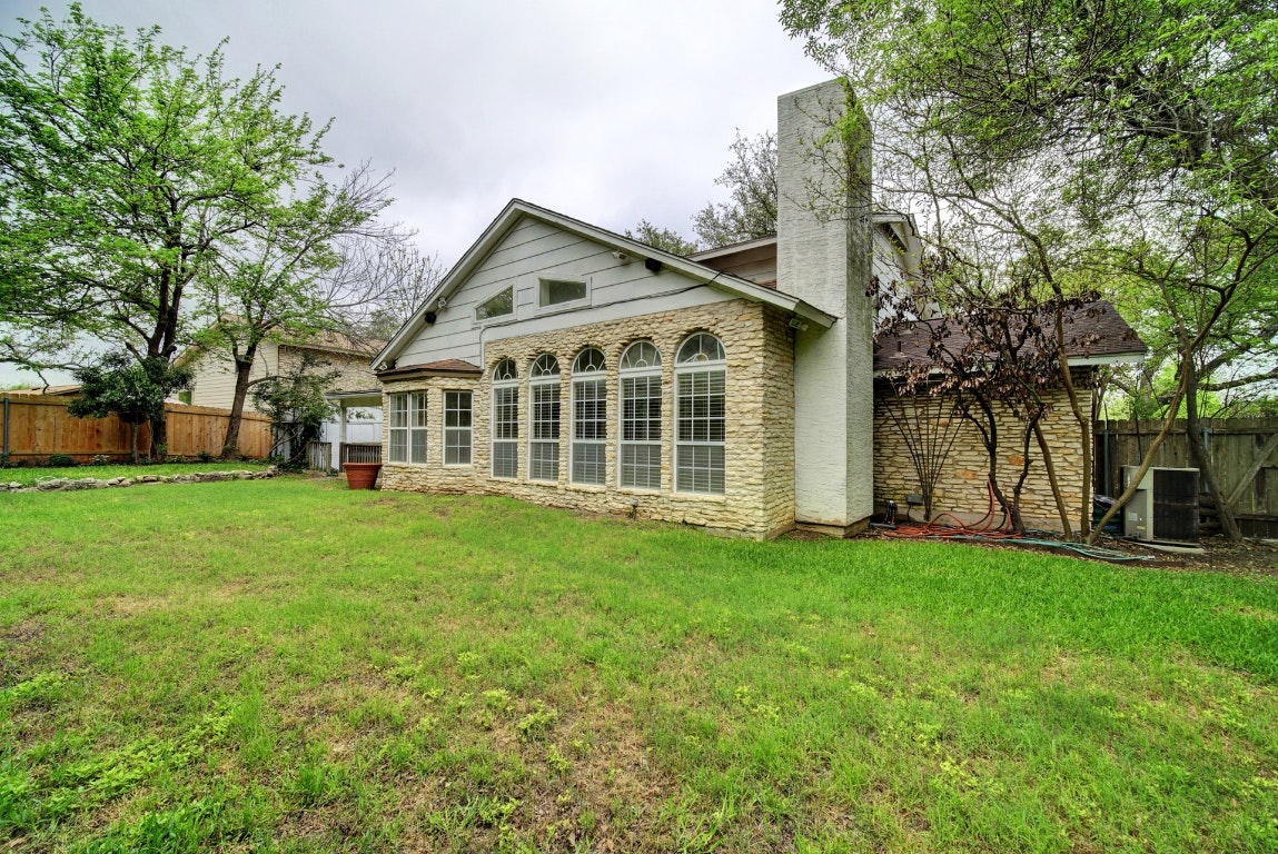 10509 Doering Lane Austin, TX 78750 - Photo 22 of 36 a view of a house with a big yard and large trees