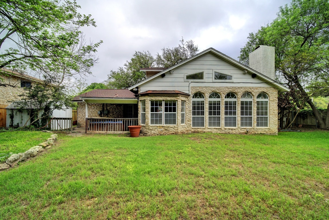 10509 Doering Lane Austin, TX 78750 - Photo 23 of 36 a front view of house with yard barbeque and outdoor seating