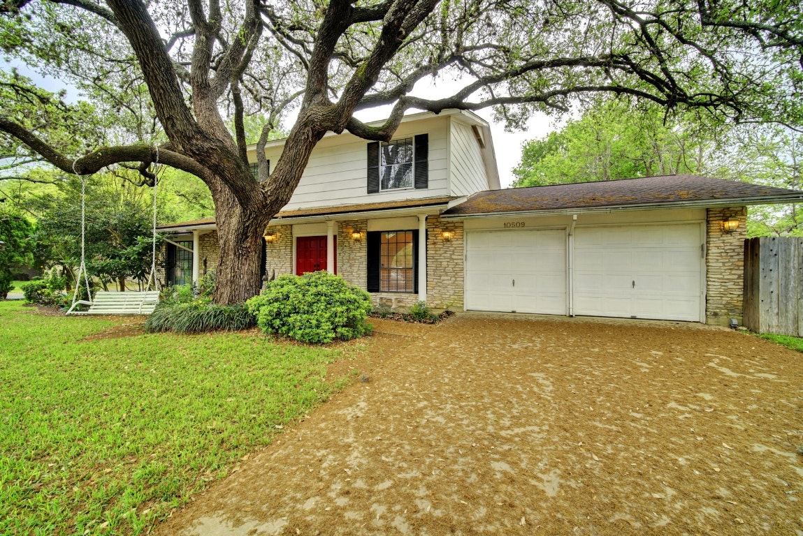 10509 Doering Lane Austin, TX 78750 - Photo 24 of 36 front view of a house with a yard