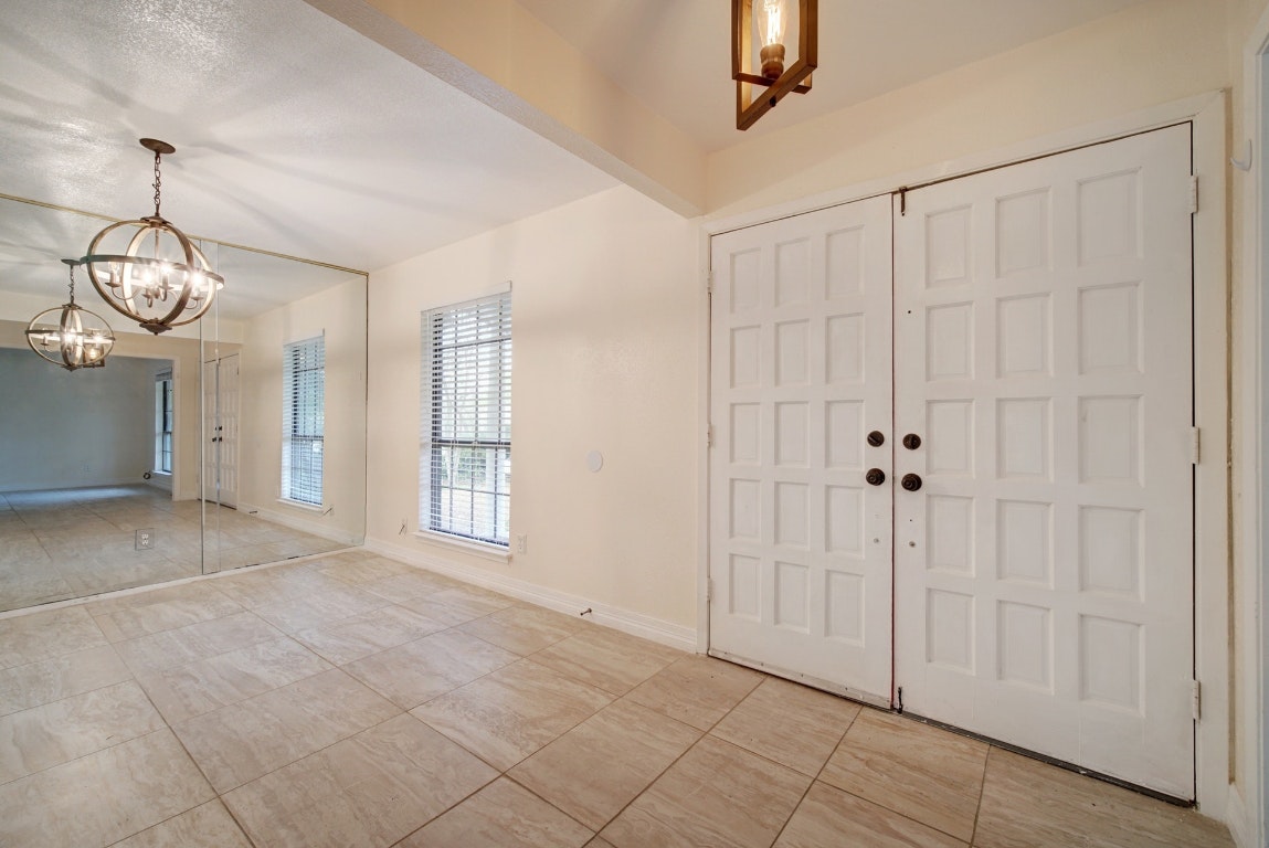 10509 Doering Lane Austin, TX 78750 - Photo 27 of 36 a view of empty room with wooden floor and fan