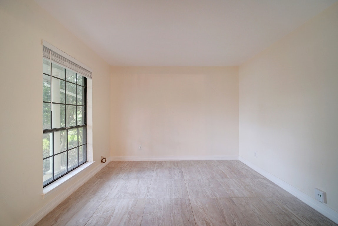 10509 Doering Lane Austin, TX 78750 - Photo 28 of 36 an empty room with wooden floor and windows
